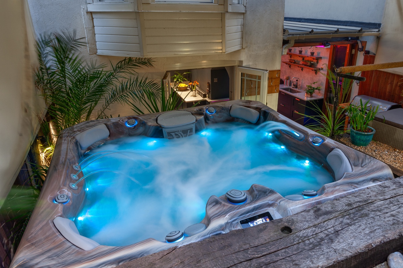 Zanzibar House courtyard hot tub lit up at night
